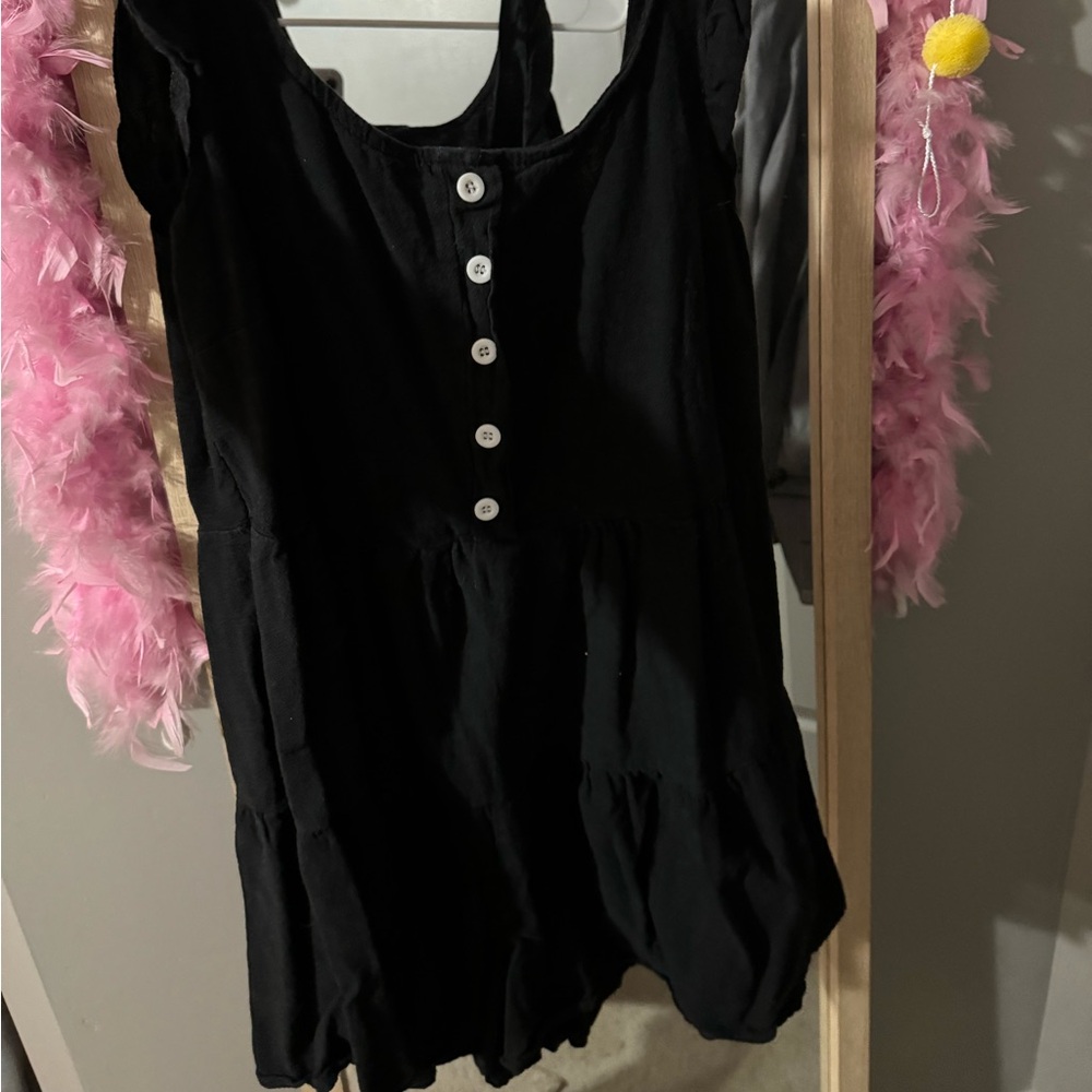 black linen button up romper with ruffle sleeve